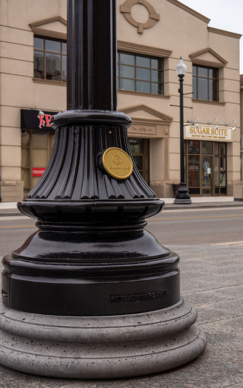 The Florentine Sr Decorative Metal Pole Installation Photo with Custom Emblem in Downtown Oakville, ON