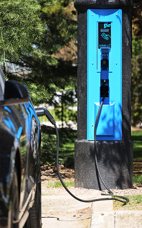 The VoltLock Concealed EV Charger Pole charging an electric vehicle